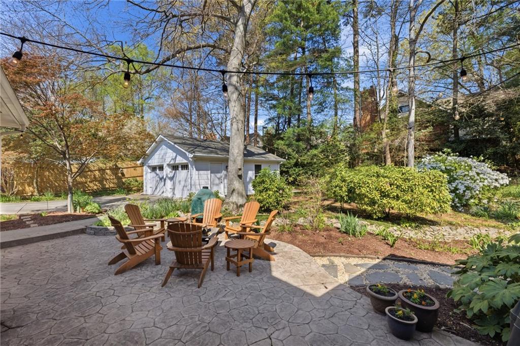 1924 Queens Way Atlanta, GA 30341 - Photo 64 of 88 a view of a patio with table and chairs and potted plants