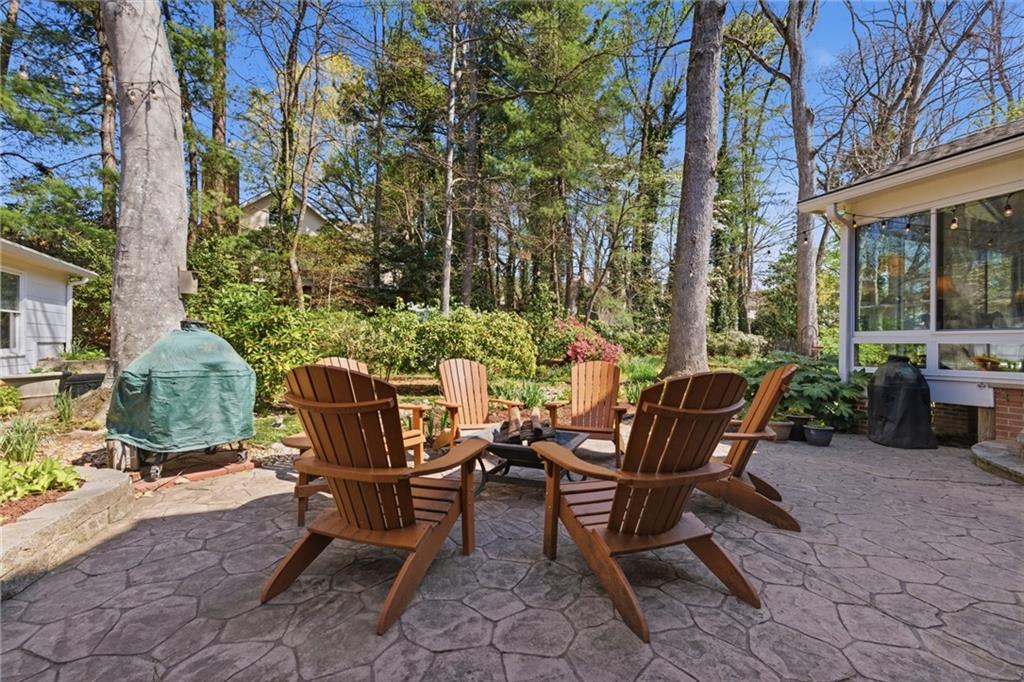 1924 Queens Way Atlanta, GA 30341 - Photo 71 of 88 a view of a patio with couple of chairs and a fire pit
