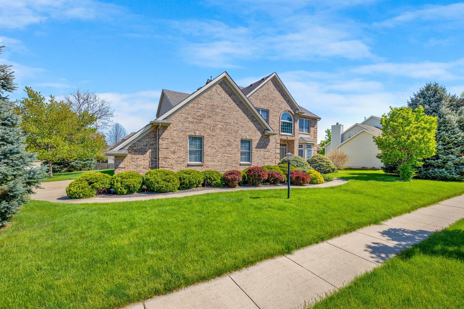 4512 Doverbrook Drive Champaign, IL 61822 - Photo 2 of 62 a front view of house with yard and green space