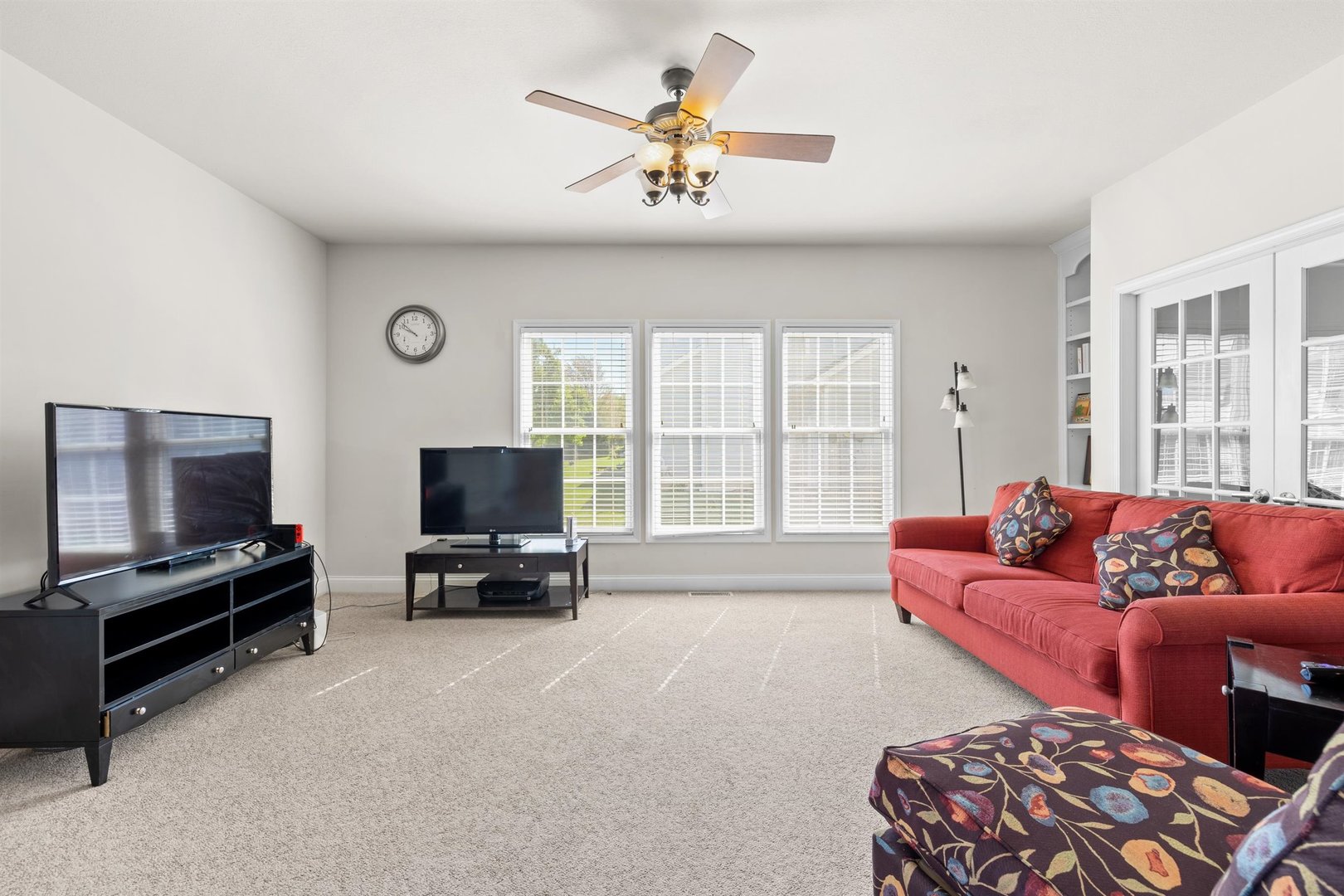 4512 Doverbrook Drive Champaign, IL 61822 - Photo 11 of 62 a living room with furniture and a flat screen tv