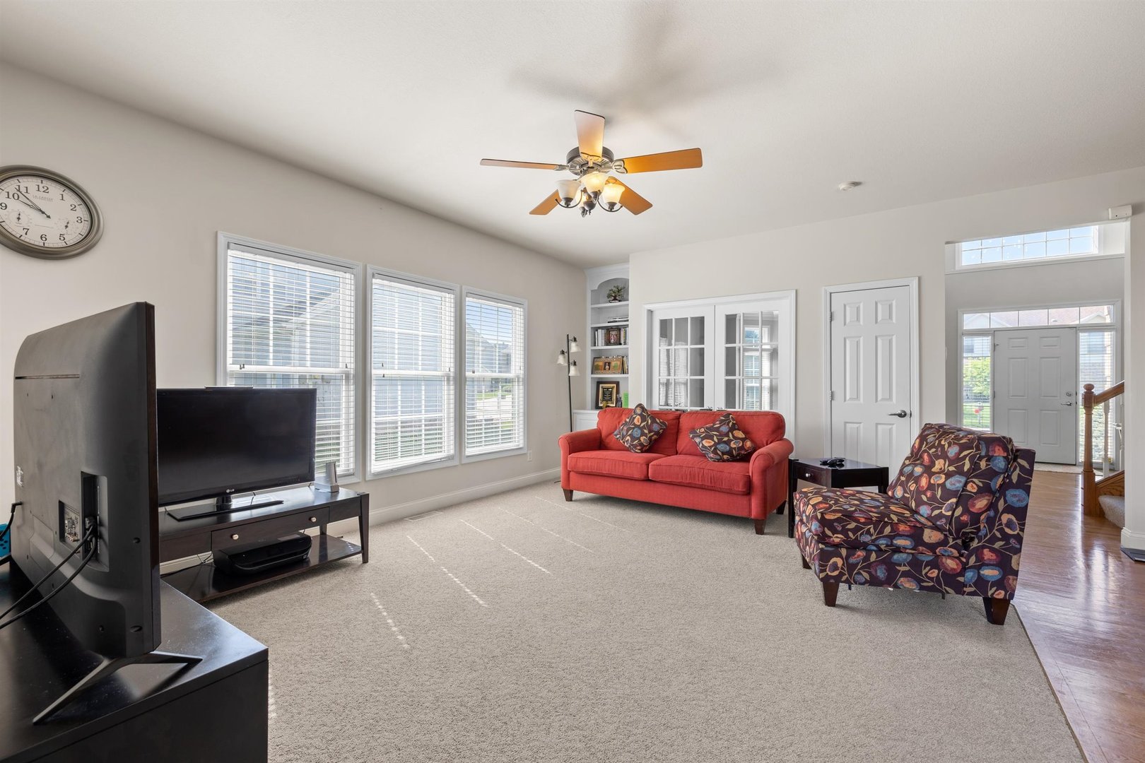 4512 Doverbrook Drive Champaign, IL 61822 - Photo 12 of 62 a living room with furniture and a flat screen tv