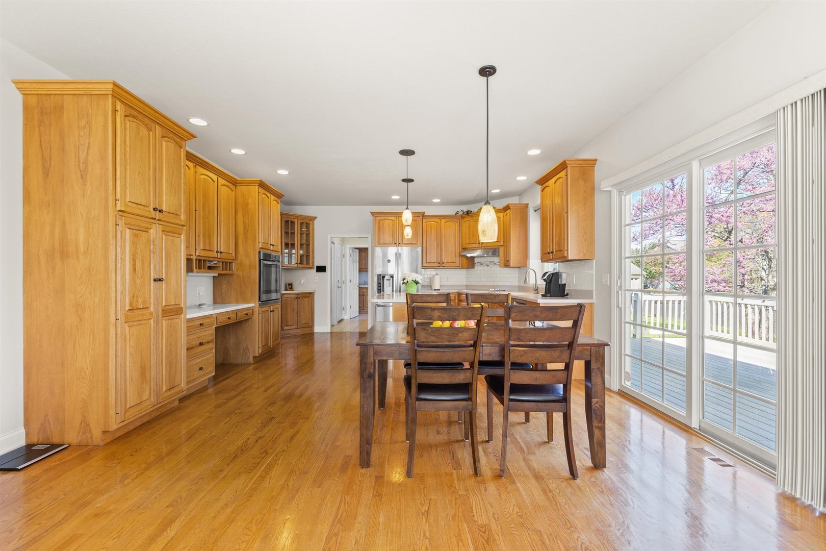 4512 Doverbrook Drive Champaign, IL 61822 - Photo 13 of 62 a view of a dining room and livingroom with furniture wooden floor a chandelier