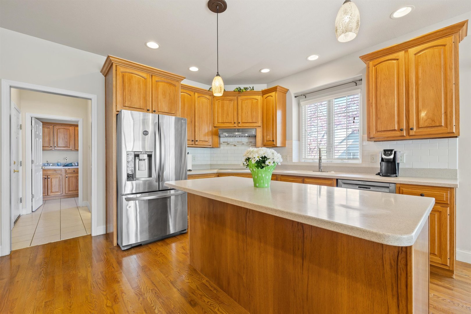 4512 Doverbrook Drive Champaign, IL 61822 - Photo 17 of 62 a kitchen with stainless steel appliances granite countertop a refrigerator a sink and a stove