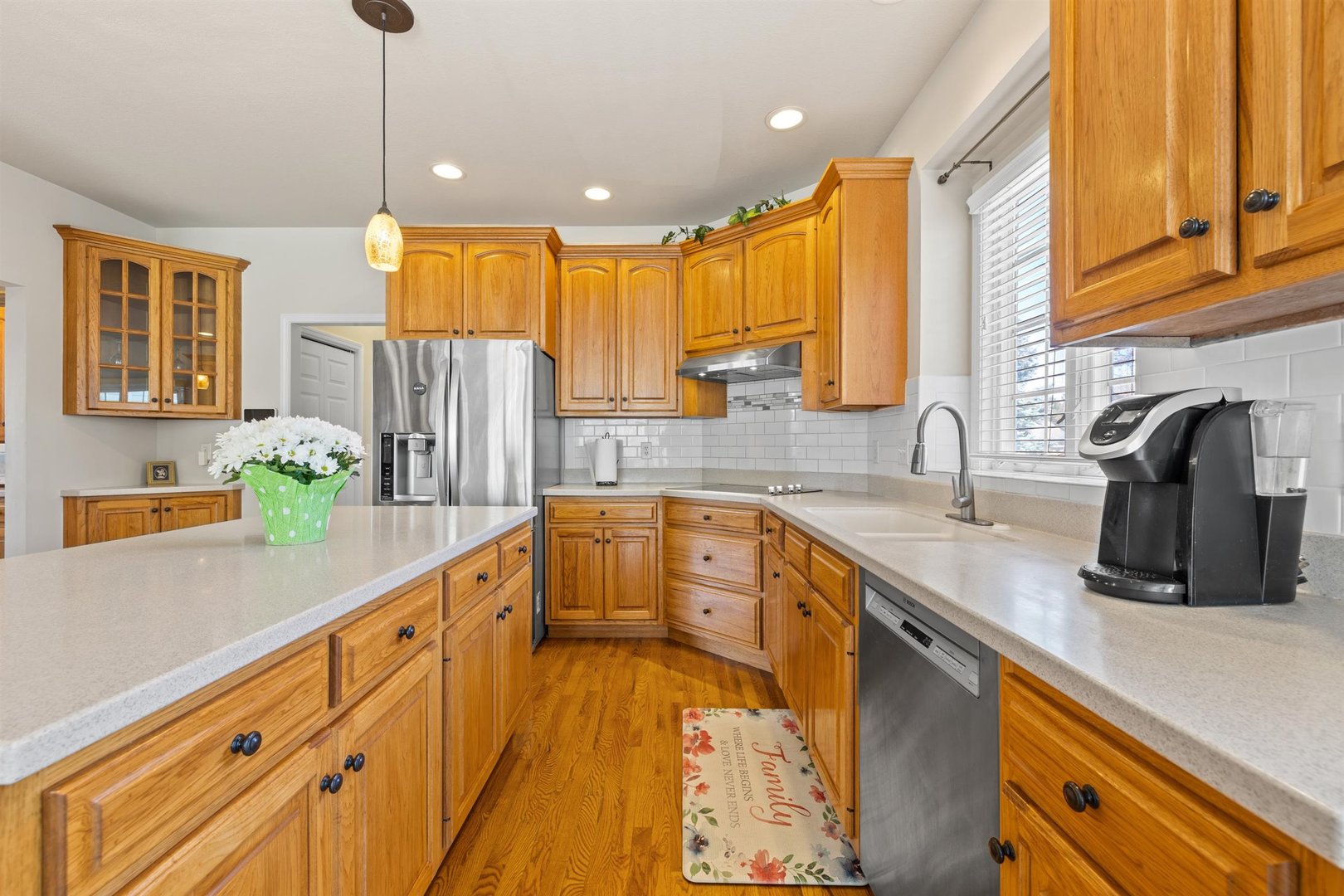 4512 Doverbrook Drive Champaign, IL 61822 - Photo 19 of 62 a kitchen with stainless steel appliances a sink dishwasher a refrigerator and a oven with wooden floor