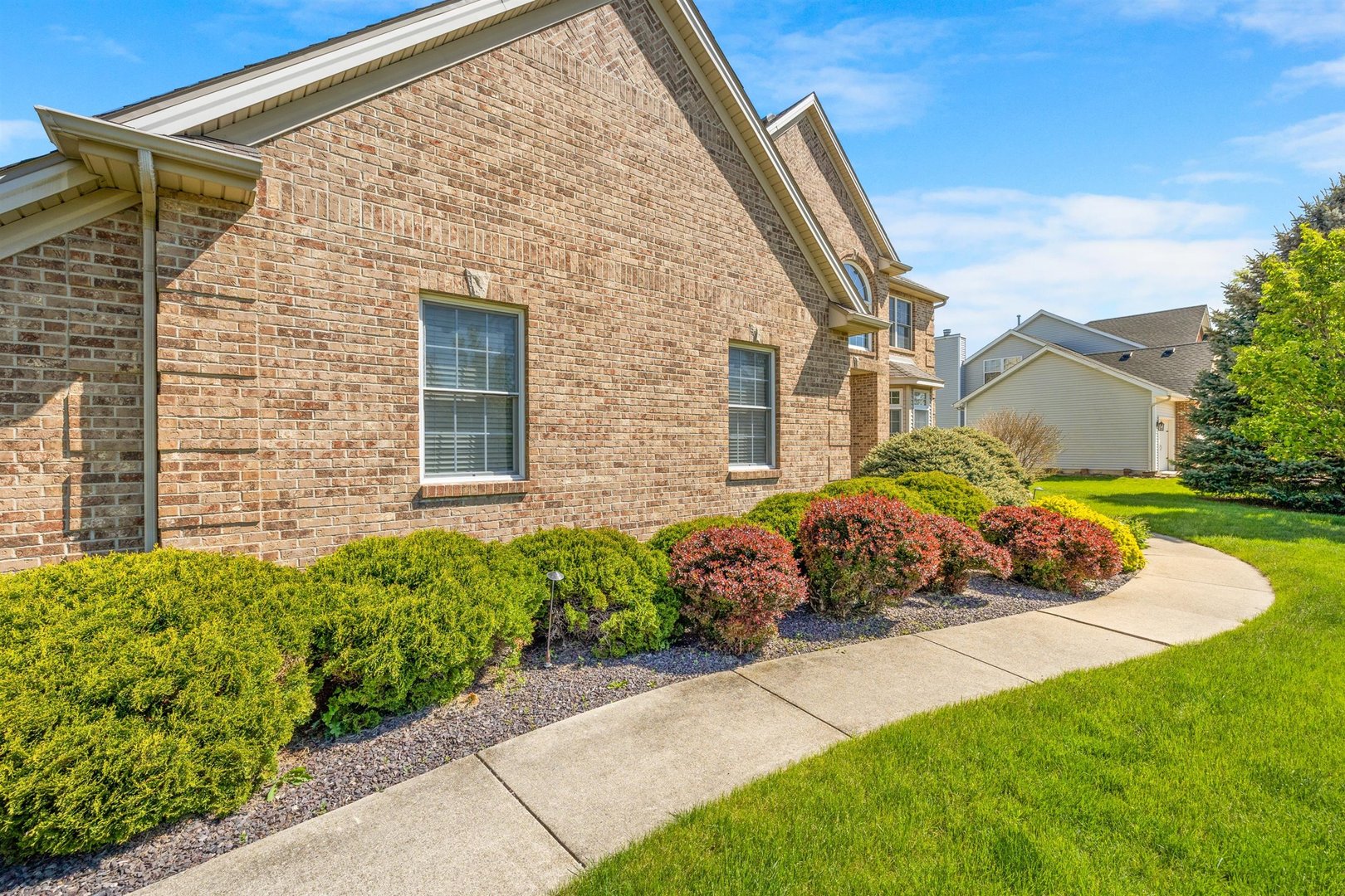 4512 Doverbrook Drive Champaign, IL 61822 - Photo 3 of 62 a front view of a house with a garden