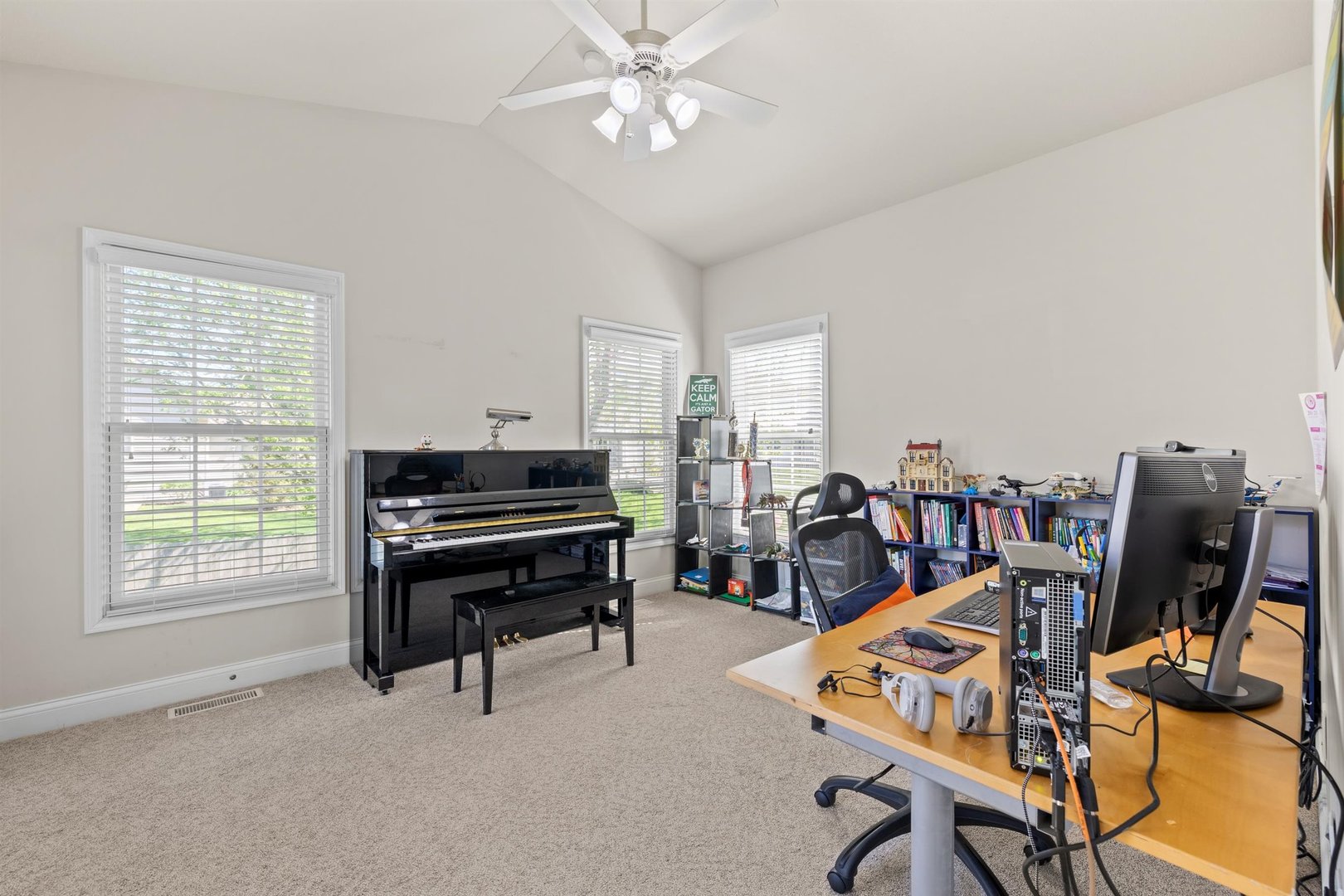 4512 Doverbrook Drive Champaign, IL 61822 - Photo 24 of 62 a view of a workspace with furniture and a window