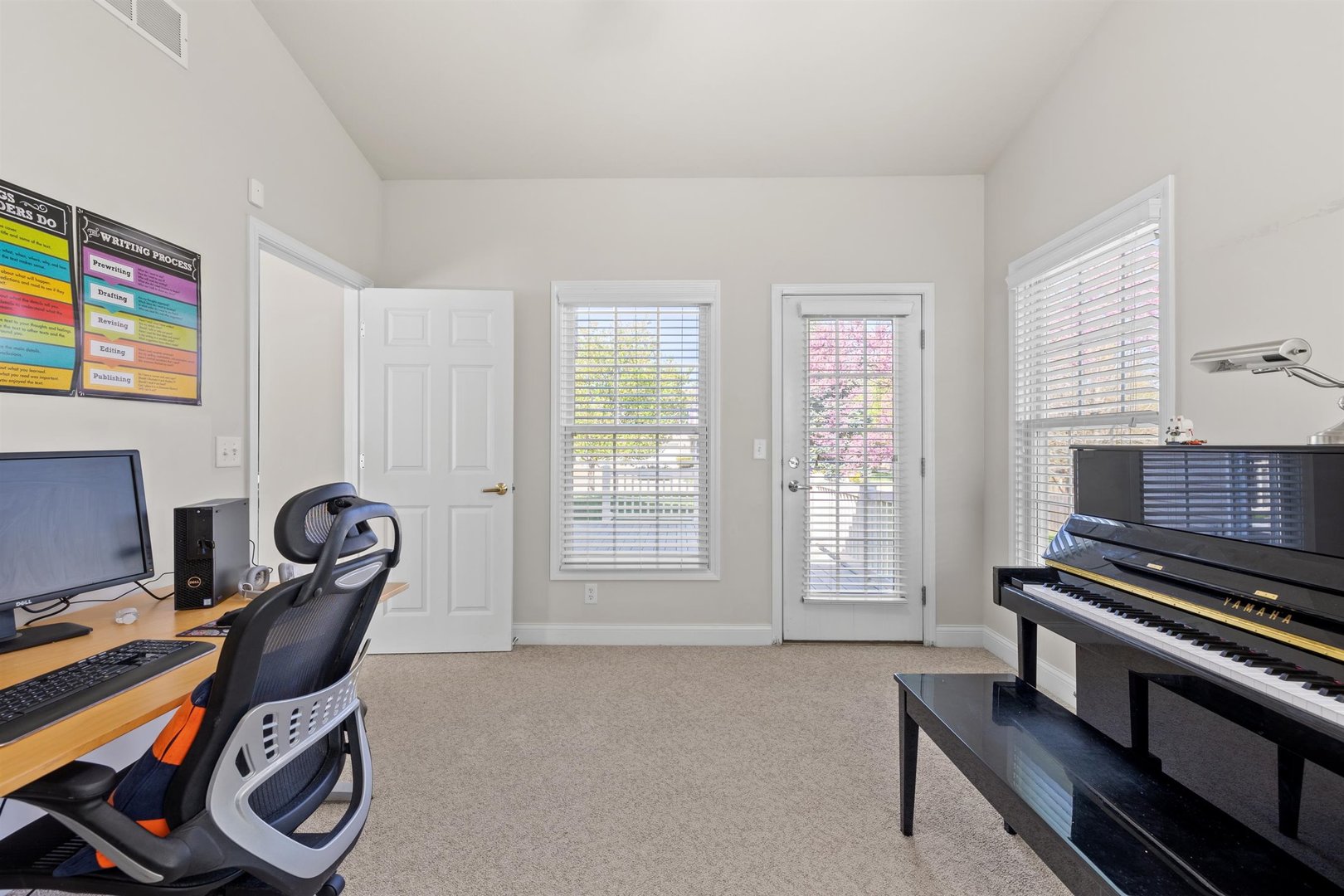 4512 Doverbrook Drive Champaign, IL 61822 - Photo 25 of 62 a view of a workspace with furniture and a window