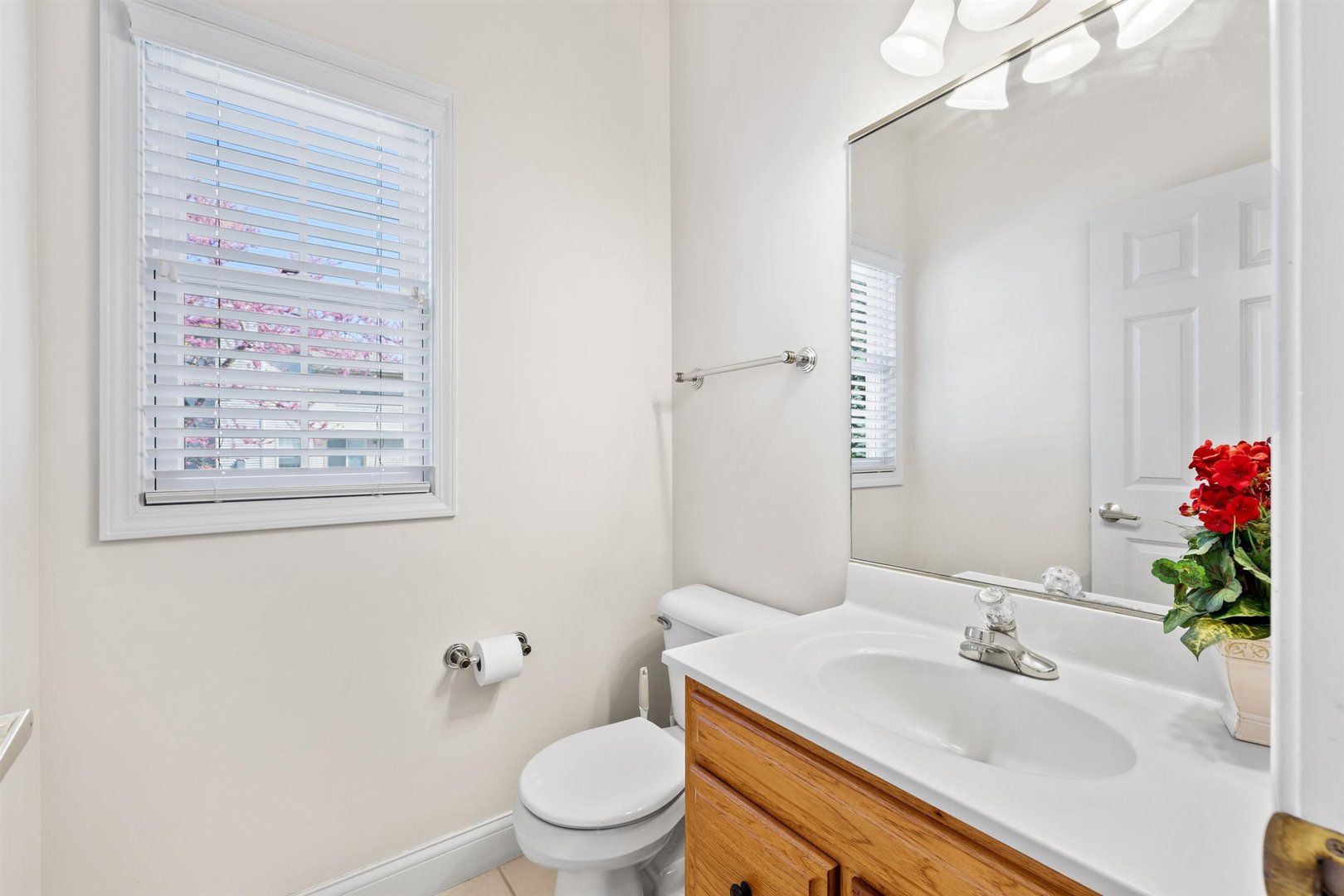 4512 Doverbrook Drive Champaign, IL 61822 - Photo 27 of 62 a bathroom with a sink toilet and a mirror