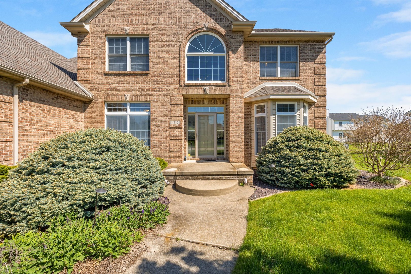 4512 Doverbrook Drive Champaign, IL 61822 - Photo 4 of 62 a front view of a house with garden