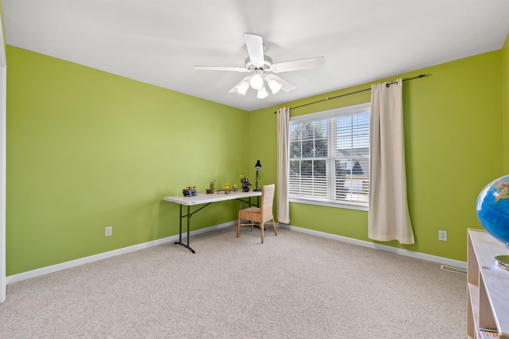 4512 Doverbrook Drive Champaign, IL 61822 - Photo 31 of 62 a view of a room with window and ceiling fan