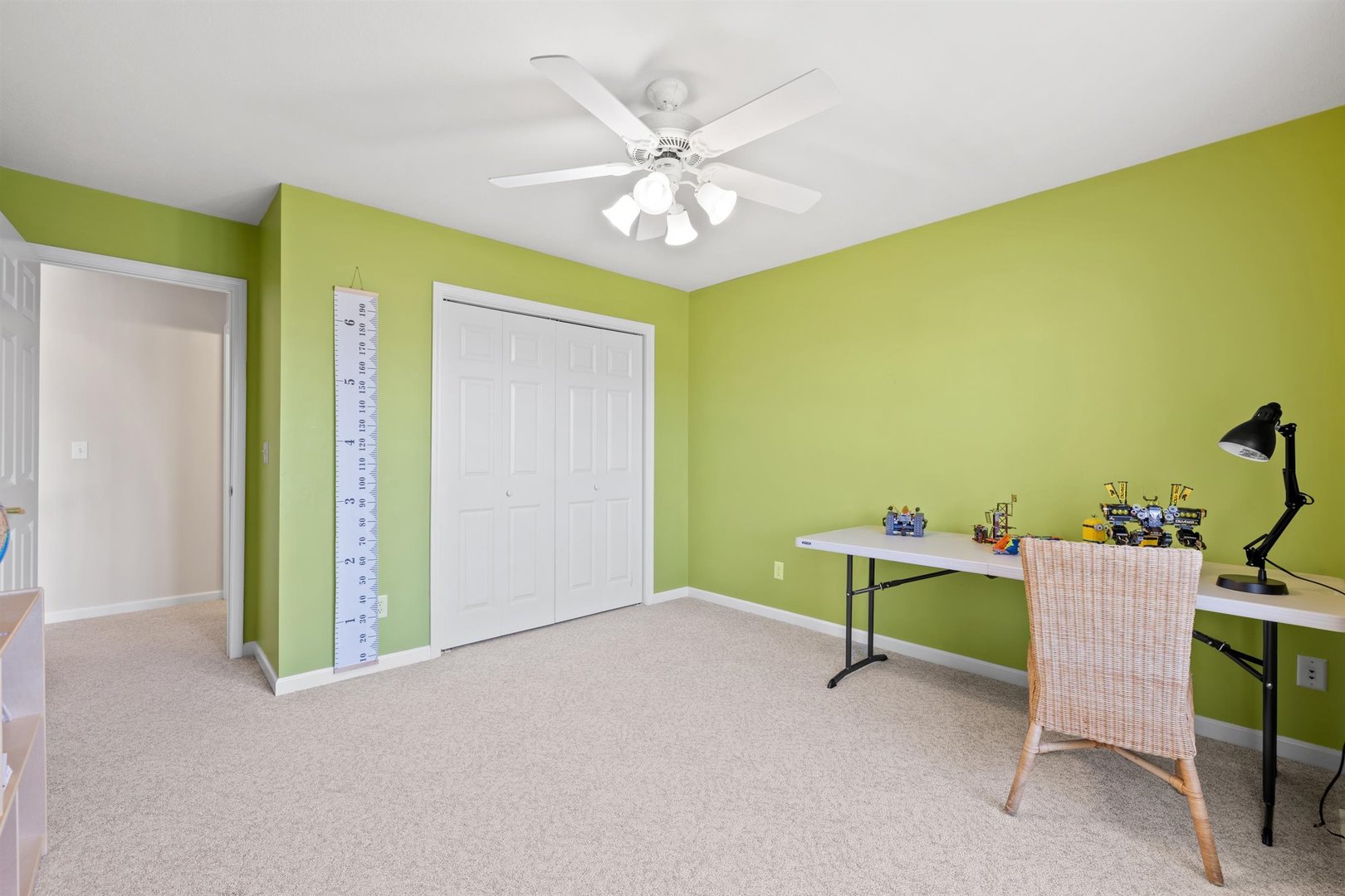 4512 Doverbrook Drive Champaign, IL 61822 - Photo 32 of 62 a view of an empty room with a window and a kitchen