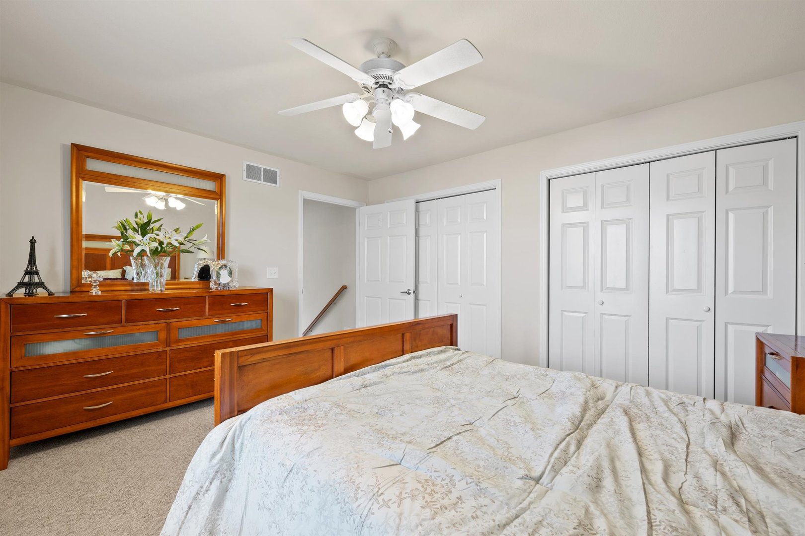 4512 Doverbrook Drive Champaign, IL 61822 - Photo 35 of 62 a bedroom with a large bed and a dresser