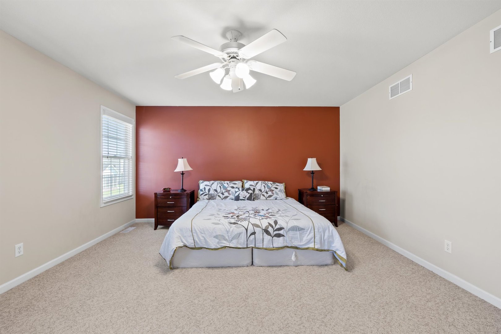 4512 Doverbrook Drive Champaign, IL 61822 - Photo 39 of 62 a bedroom with a bed and a chandelier