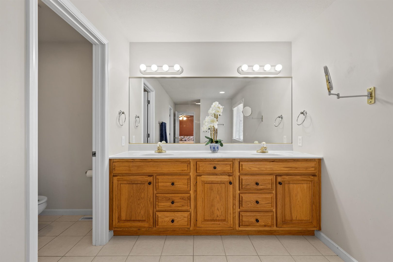 4512 Doverbrook Drive Champaign, IL 61822 - Photo 42 of 62 a spacious bathroom with a granite countertop sink a mirror and a