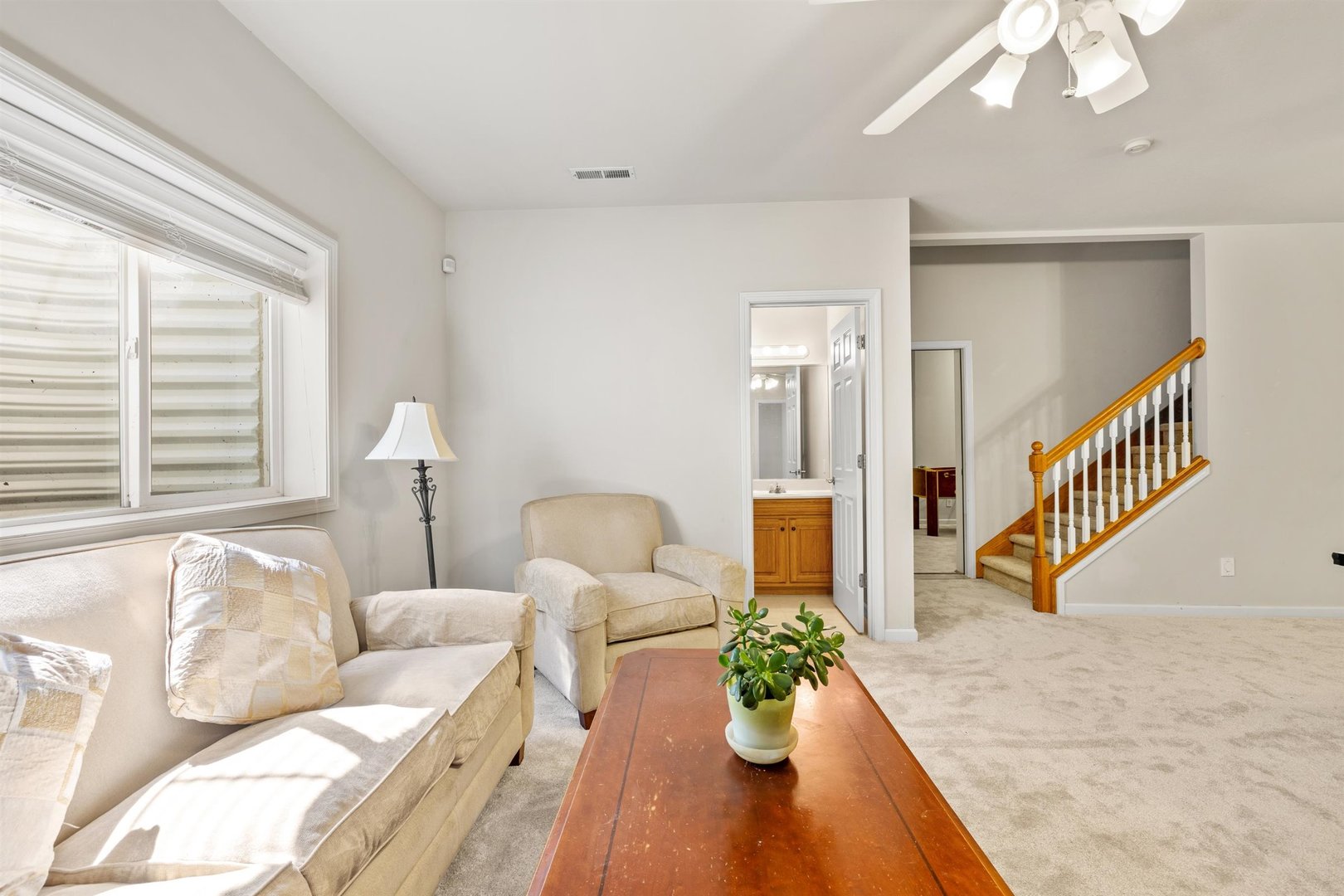 4512 Doverbrook Drive Champaign, IL 61822 - Photo 47 of 62 a living room with furniture flowerpot and a chandelier