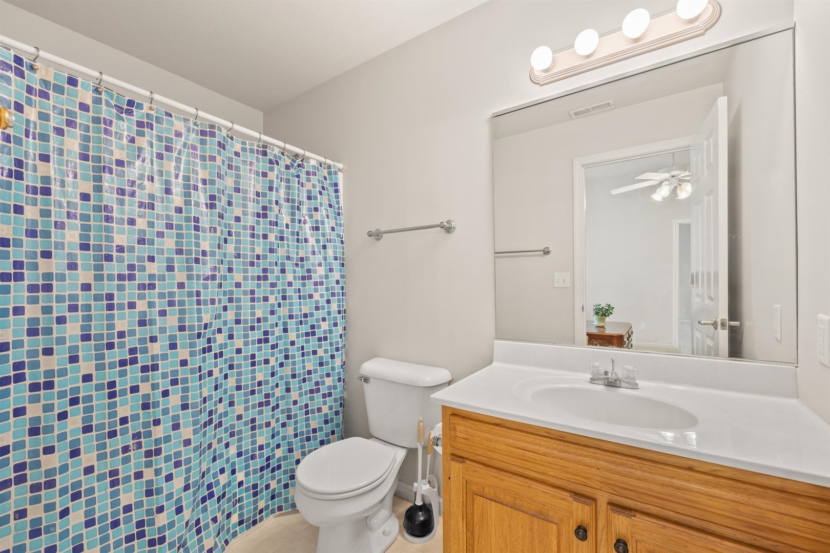 4512 Doverbrook Drive Champaign, IL 61822 - Photo 48 of 62 a bathroom with a sink a toilet and a mirror