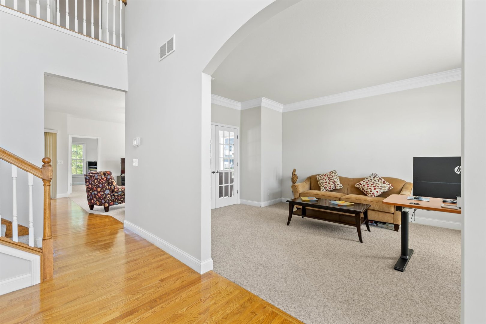 4512 Doverbrook Drive Champaign, IL 61822 - Photo 7 of 62 a living room with furniture and a wooden floor