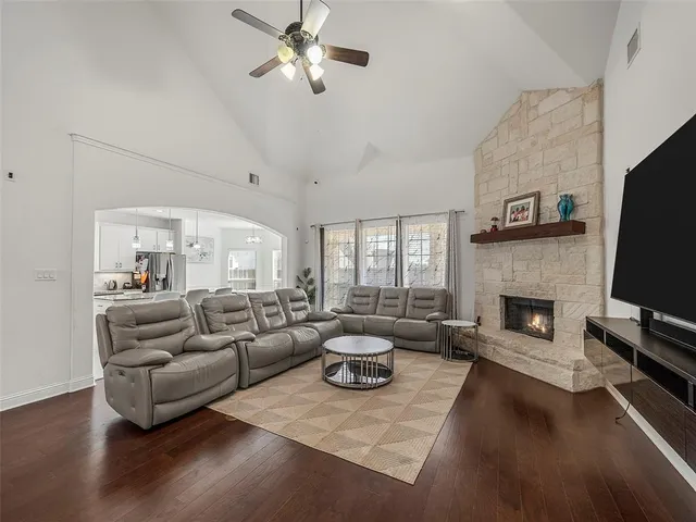 a kitchen with granite countertop a sink a center island a counter space and a window