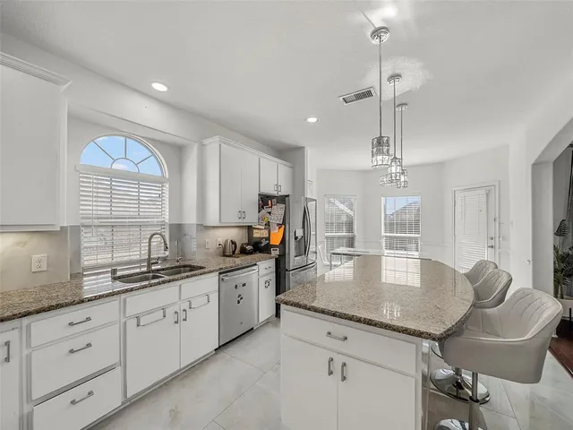 a view of a dining room with furniture and window