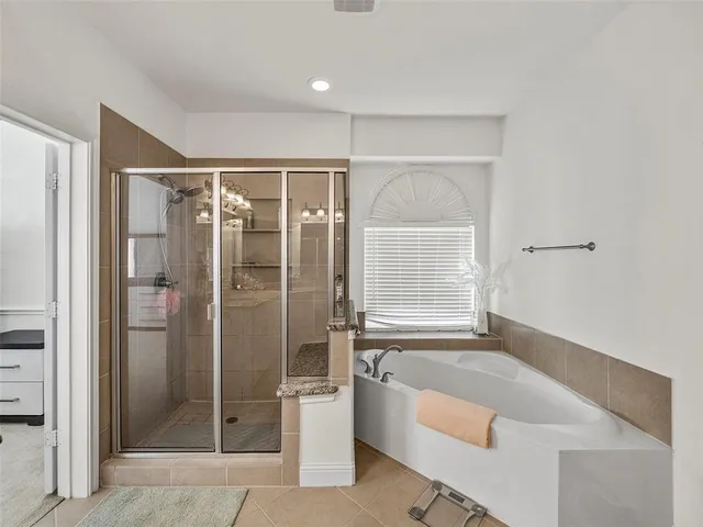 a view of living room with furniture and a fireplace
