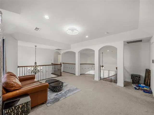 a bedroom with a bed and a table in it