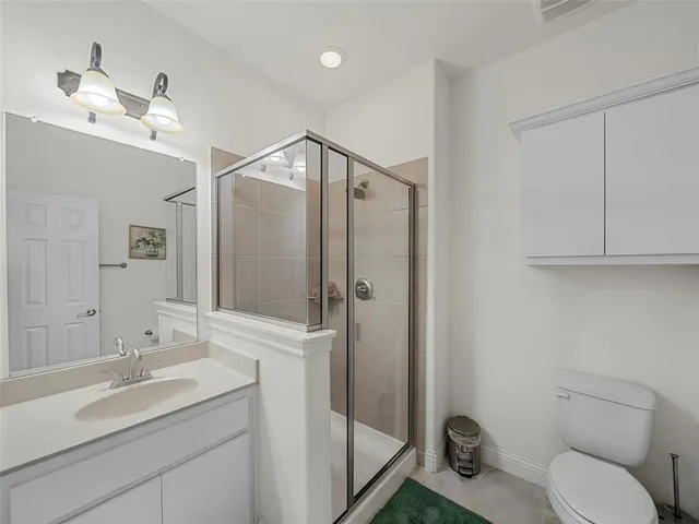 a picture of a bathroom with a shower
