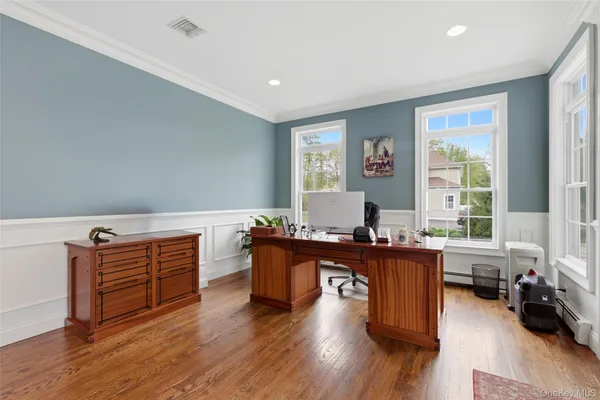 a living room with furniture window and wooden floor