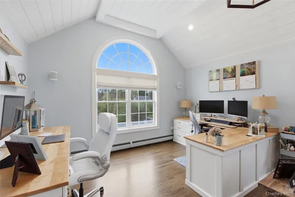 a workspace with furniture and a window