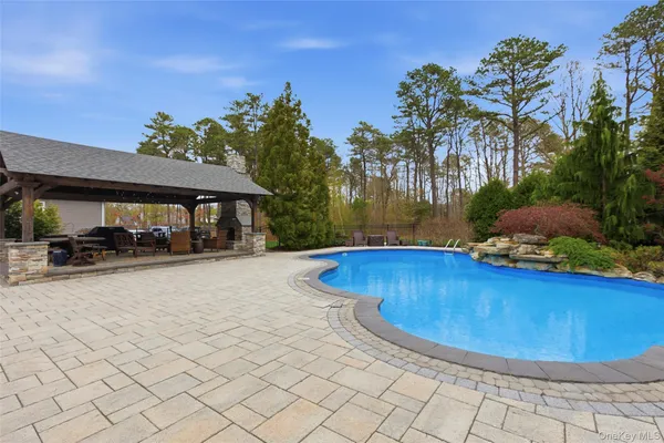 a view of a swimming pool with lounge chair