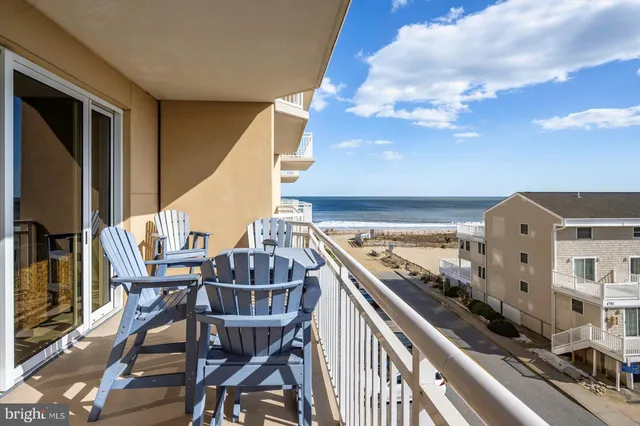 a kitchen with granite countertop a sink stove and refrigerator