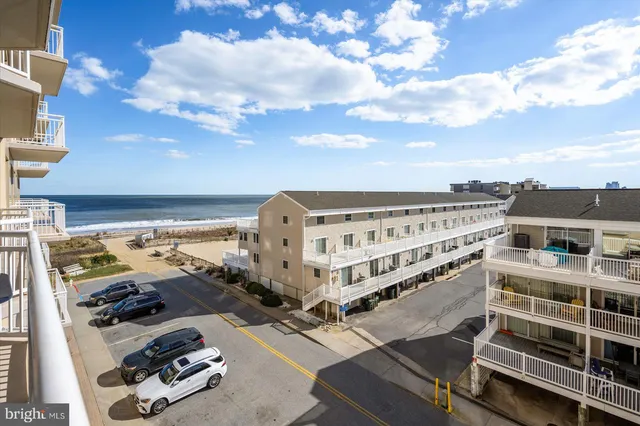 a kitchen with stainless steel appliances granite countertop a sink and a refrigerator