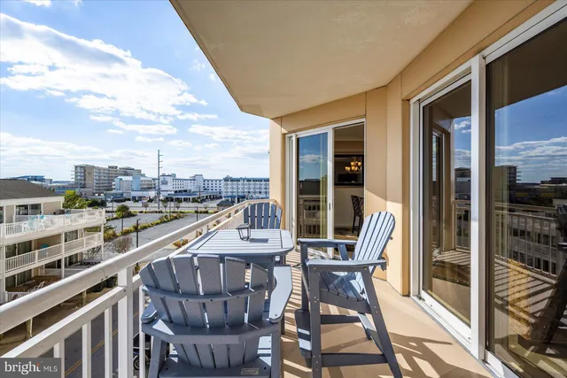 a kitchen with stainless steel appliances kitchen island granite countertop a refrigerator and microwave