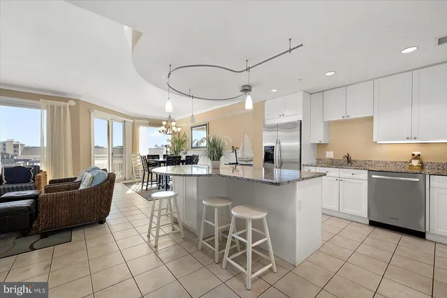 a living room with furniture flowerpot and window