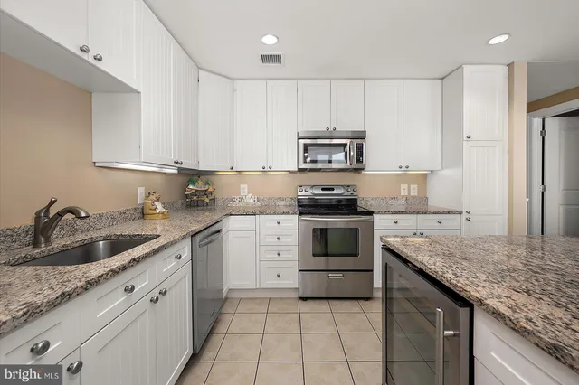 a bedroom with a large bed and a couch