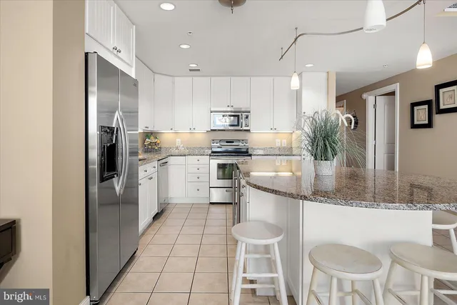 a bathroom with a tub a sink and a shower