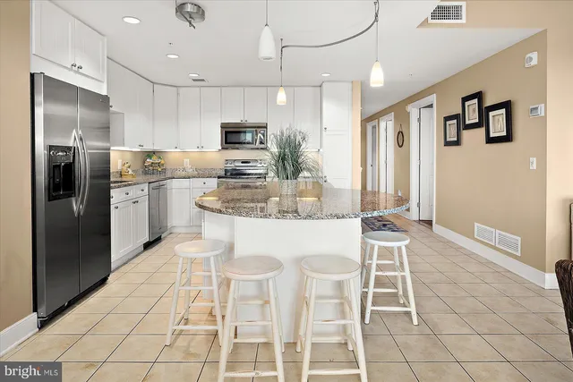 a spacious bathroom with a tub sink and mirror