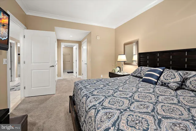 a bathroom with a granite countertop sink mirror vanity and toilet