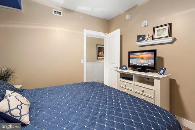 a view of a terrace with two chairs and a potted plant