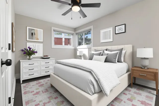 a bed room with a bed and a dresser