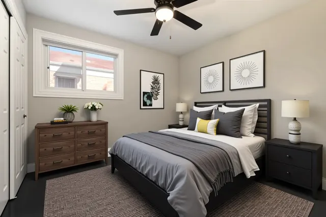 a bed room with a bed and a window