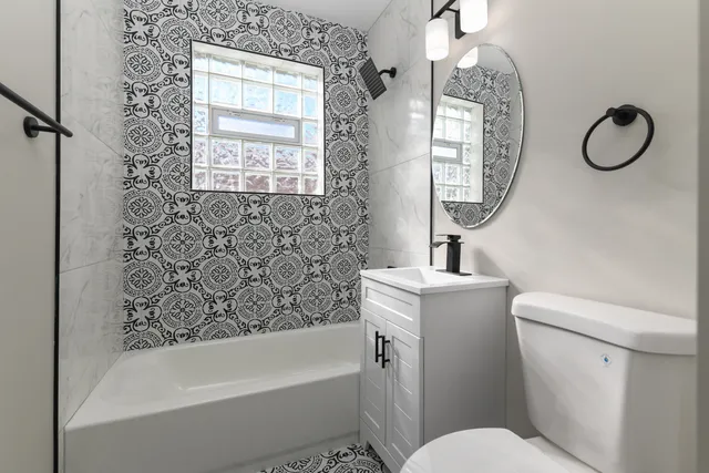 a bathroom with a toilet sink and bathtub