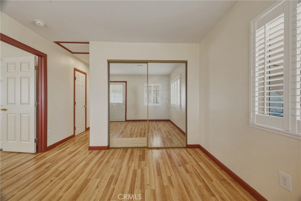 13407 Kagel Canyon Road Sylmar, CA 91342 - Photo 12 of 31 wooden floor in an empty room with a window