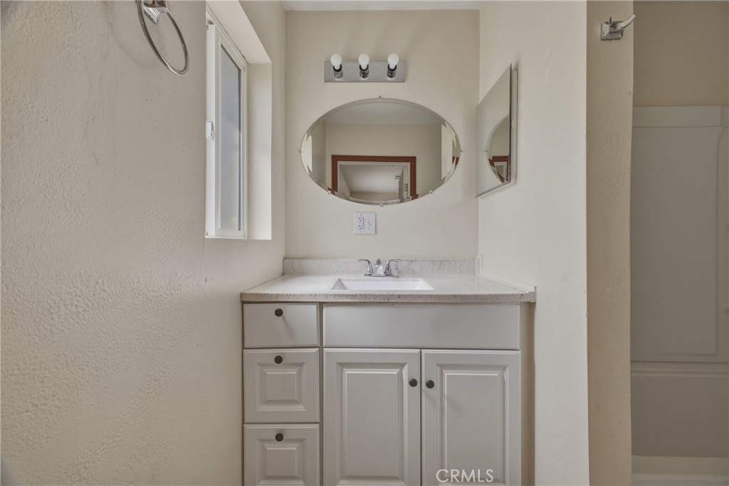 13407 Kagel Canyon Road Sylmar, CA 91342 - Photo 16 of 31 a bathroom with a sink and a mirror