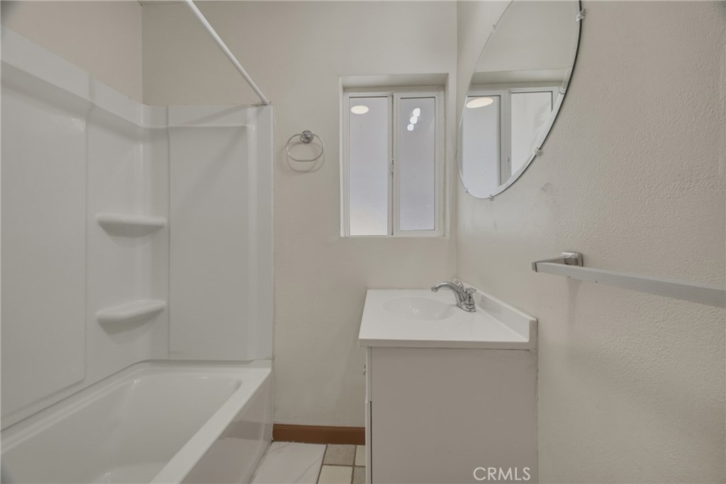 13407 Kagel Canyon Road Sylmar, CA 91342 - Photo 18 of 31 a bathroom with a tub sink and mirror