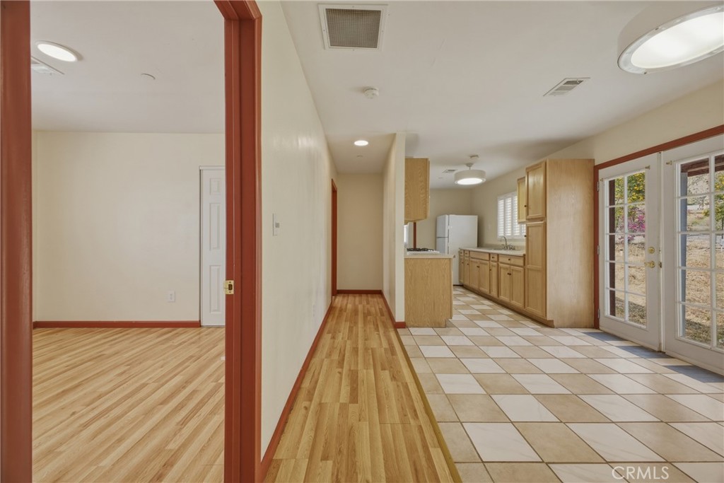 13407 Kagel Canyon Road Sylmar, CA 91342 - Photo 20 of 31 a view of a hallway with wooden floor