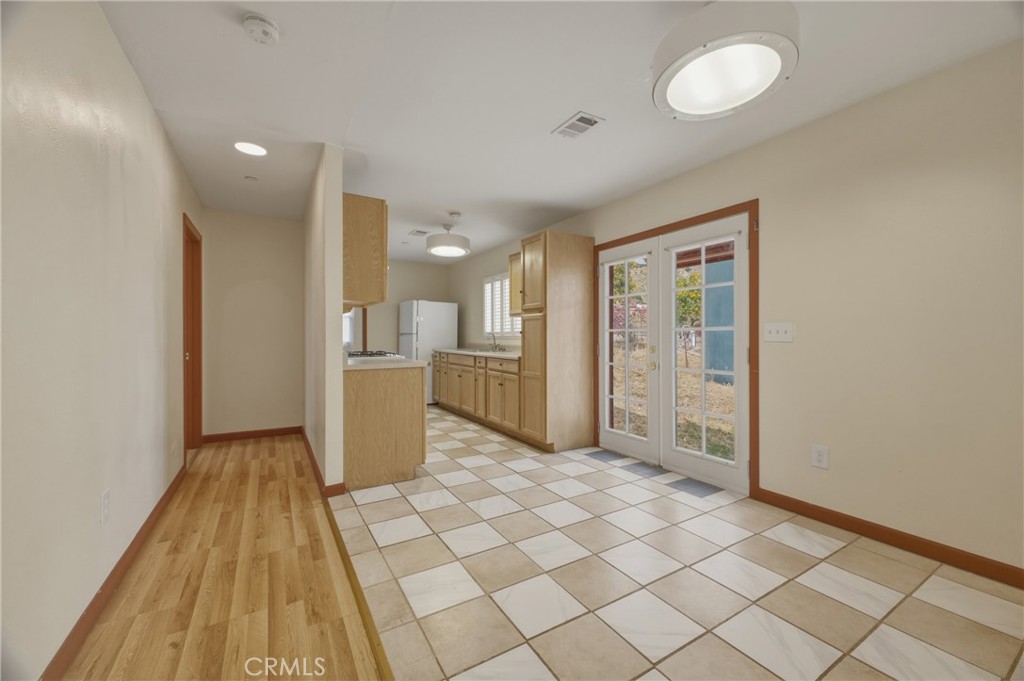13407 Kagel Canyon Road Sylmar, CA 91342 - Photo 21 of 31 a view of a kitchen with a sink and a refrigerator