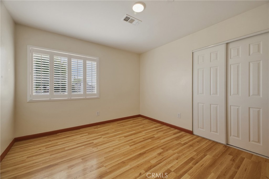 13407 Kagel Canyon Road Sylmar, CA 91342 - Photo 23 of 31 a view of an empty room with wooden floor and a window