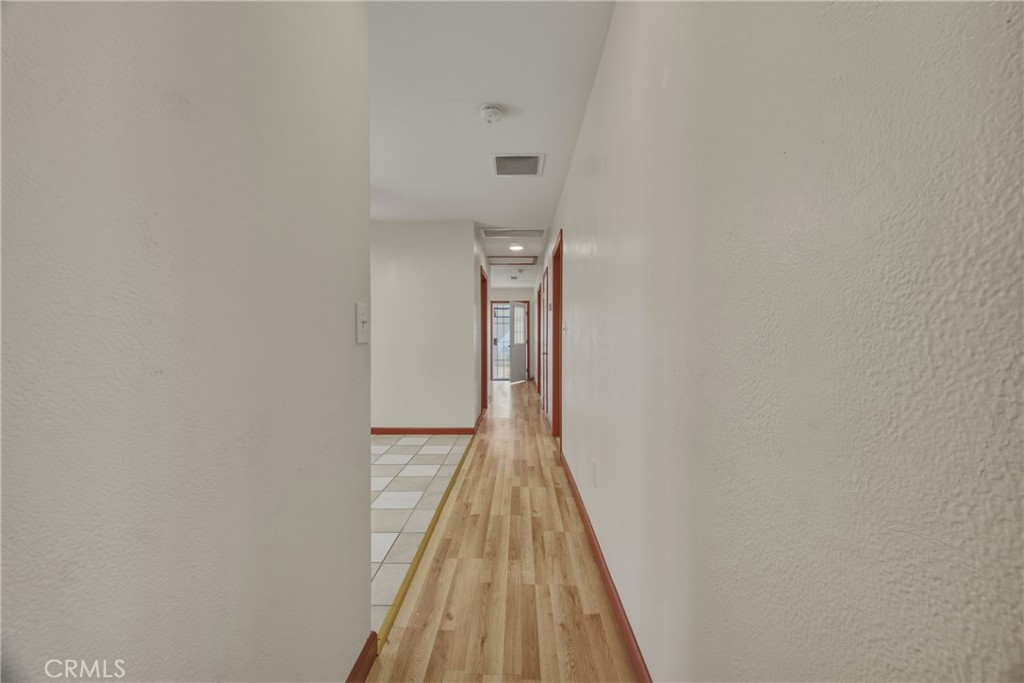 13407 Kagel Canyon Road Sylmar, CA 91342 - Photo 26 of 31 a view of a hallway with wooden floor and entryway
