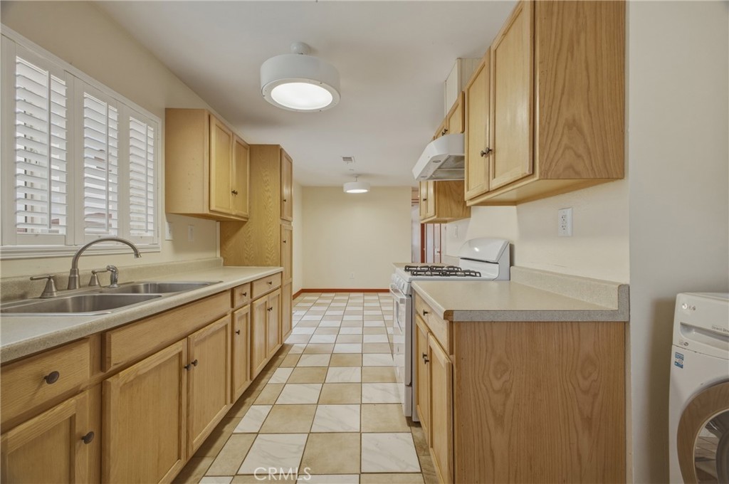 13407 Kagel Canyon Road Sylmar, CA 91342 - Photo 29 of 31 a kitchen with a sink and cabinets
