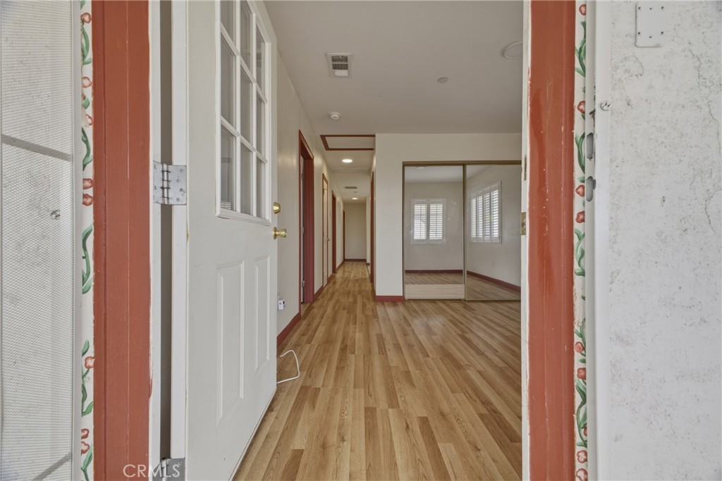 13407 Kagel Canyon Road Sylmar, CA 91342 - Photo 10 of 31 a view of a room with wooden floor a glass door and shower
